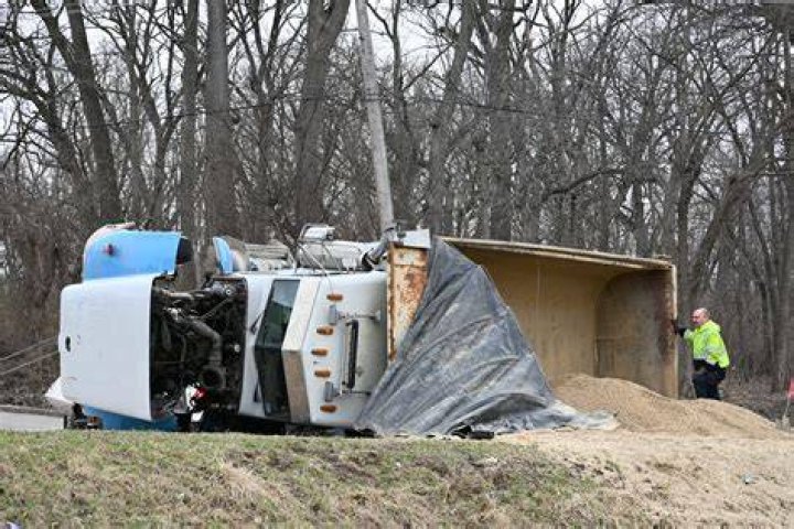 4 Hospitalized After Dump Truck Rolls Over on Car