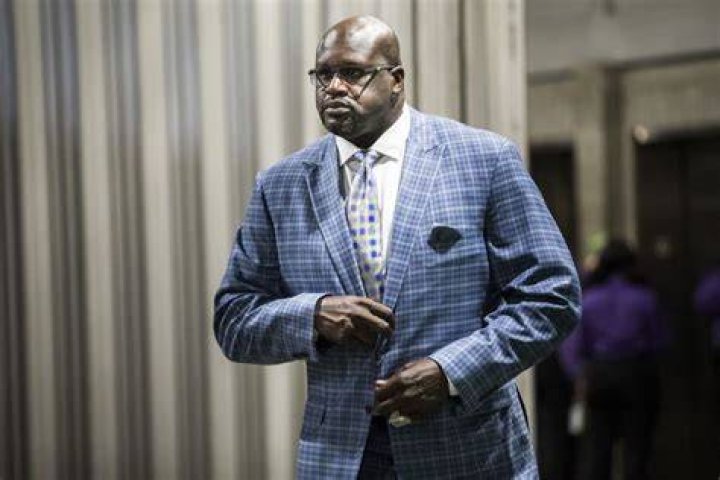 50 Year Old Shaquille O’Neal Spotted in Pink Swimsuit on the Beach and Dwyane
Wade Can’t Believe His Eyes