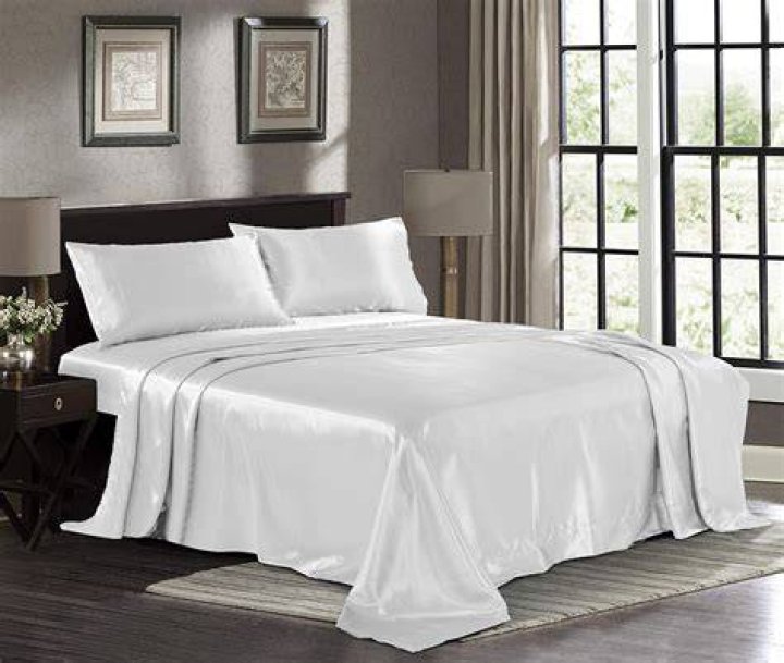 a bed with white sheets