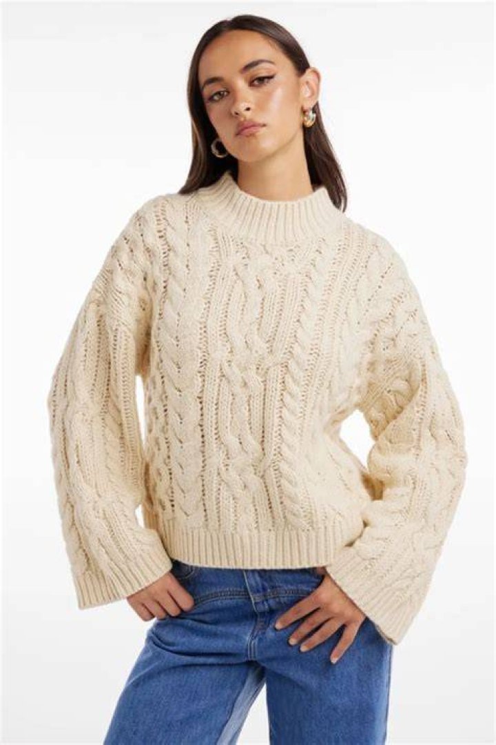 A cable-knit jumper A cable-knit jumper