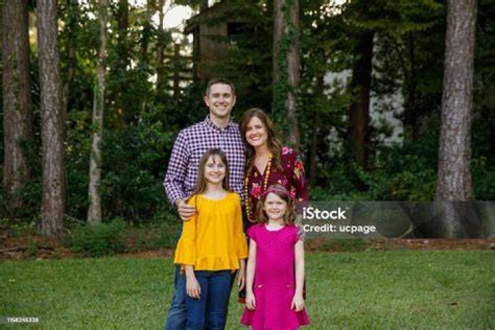 A family standing outside of their home for Wife Swap