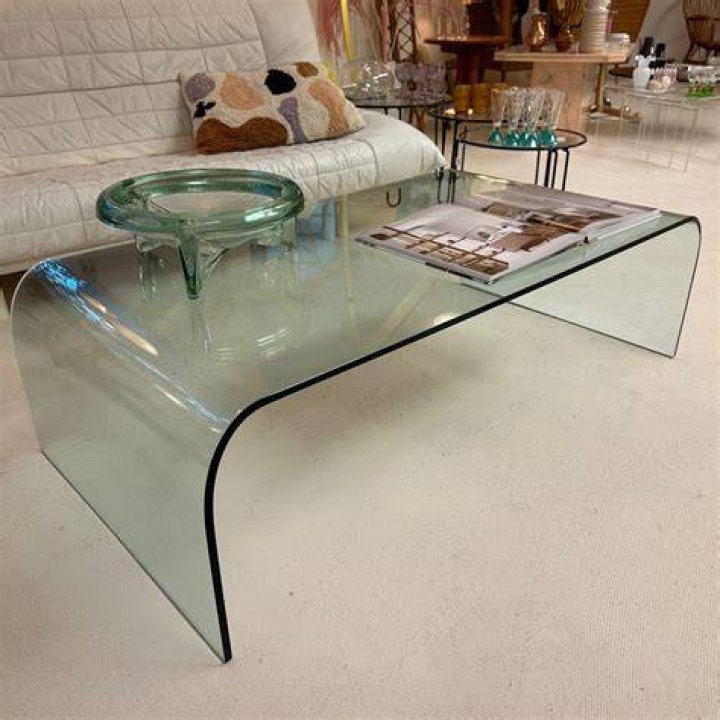 A glass waterfall table with a wooden sphere. Photo / Agnes Lloyd-Platt