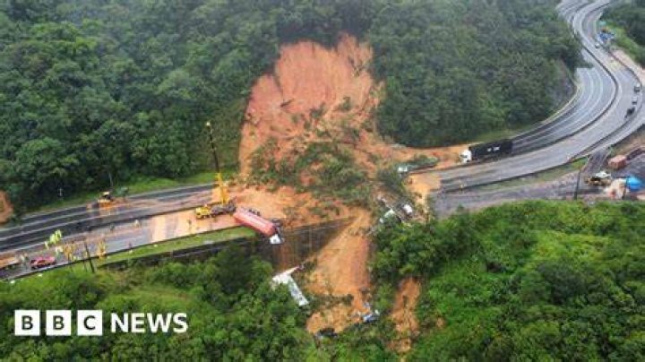 A landslide fell on a house and cars in Maungatapu. Photo / Andrew Warner