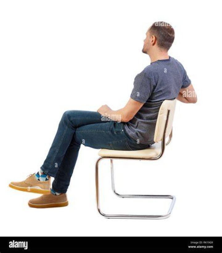 a person sitting on a bed a person sitting on a bed