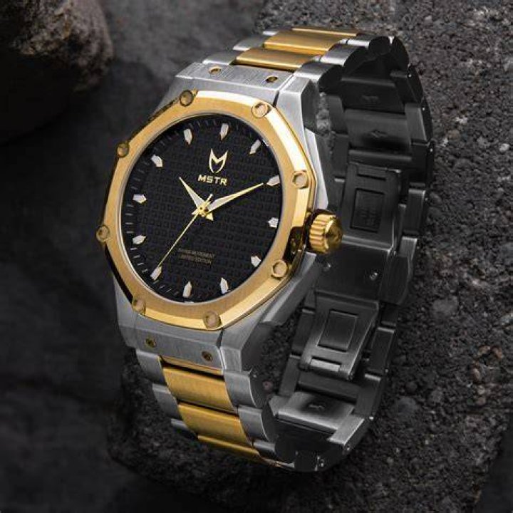 a silver and gold watch a silver and gold watch