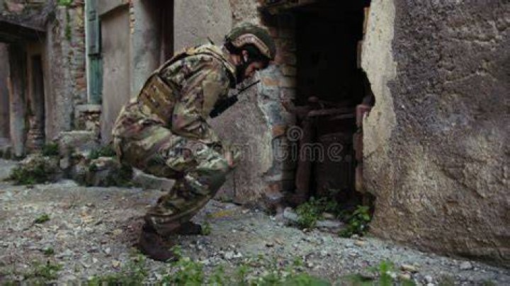 A soldier looks at a statue of an angel in Storming Juno