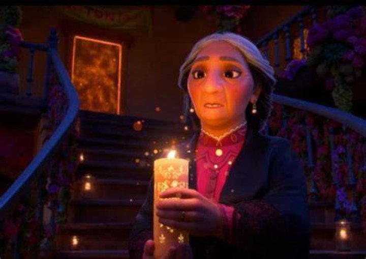 Abuela carrying the magical candle on Encanto