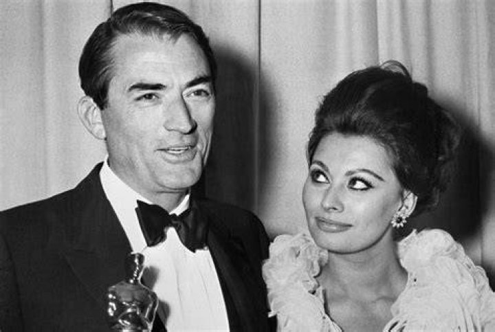 Academy Awards in 1963 with producer Sam Spiegel and Original Dior sketches