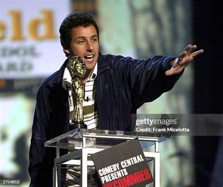 Adam Sandler's character in Hustle sitting in the bleachers