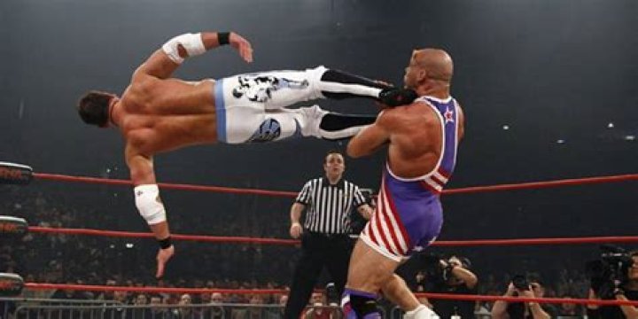 AJ Styles Dropkicks Kurt Angle