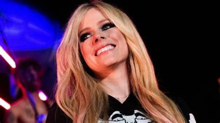 Avril Lavigne sports memorable seethrough vest and necktie as she