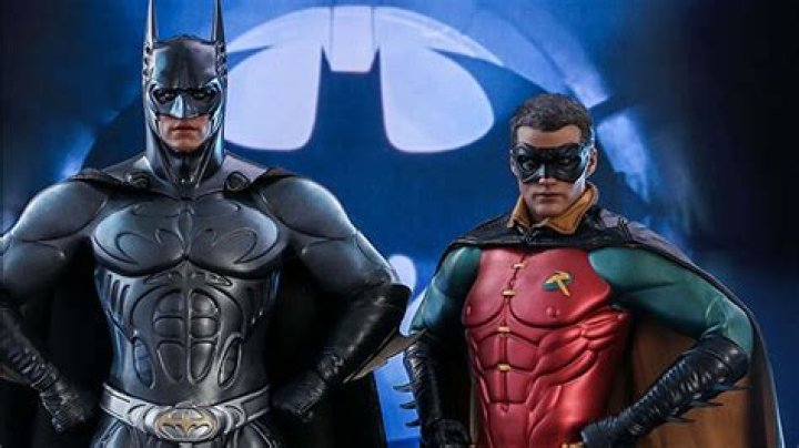 Batman and Robin standing together.