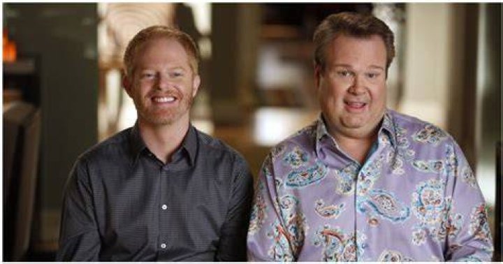 Cam and Mitch at the airport in Modern Family