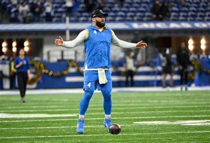 Chase Daniel in a blue coat and floral shirt (L). Chase Daniel in a brown bow tie and chequered coat (R).