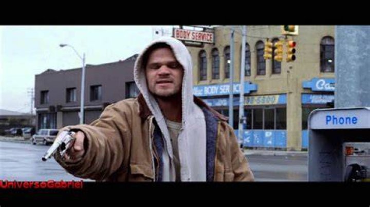 Cheddar Bob holding a gun in 8 Mile