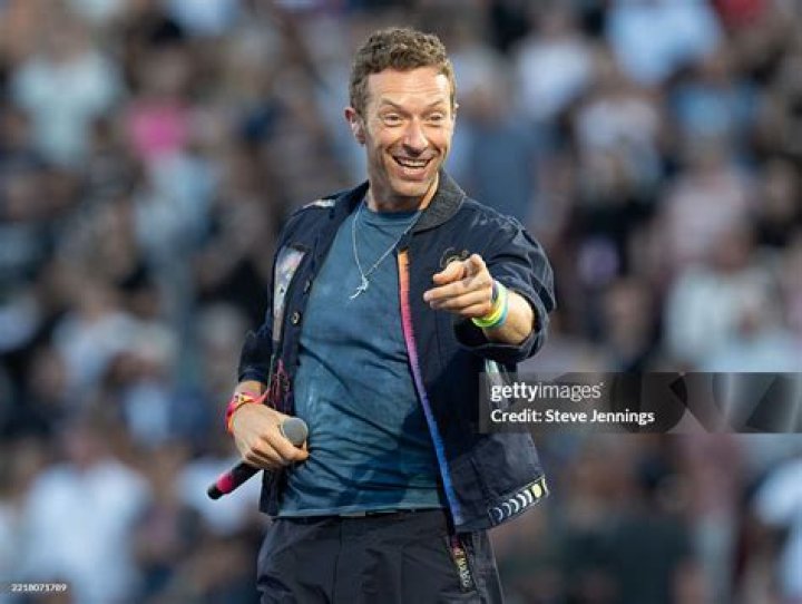 Chris Martin's blue-eyed gorilla character up close