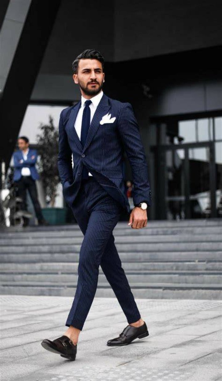 Clothing, Suit, Fashion, Formal wear, Event, Headgear, Uniform, Outerwear, Coat, White-collar worker, 