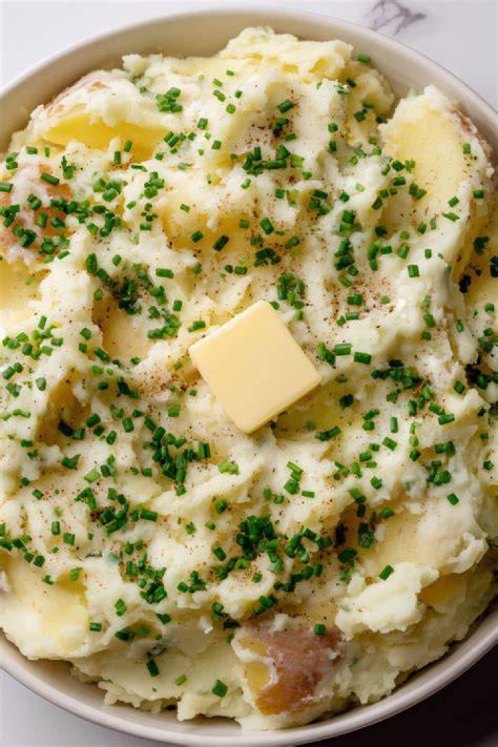 Cottage cheese, butter and chives on whole grain bread, close up Cottage cheese, butter and chives on whole grain bread, close up