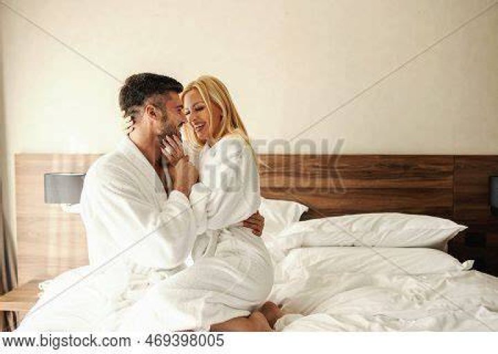 Couple foreplay in bed