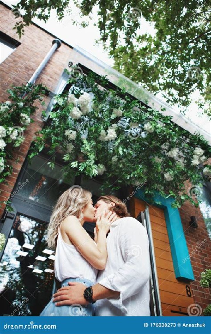 Couple kissing outside in the sunset in Wild At Heart