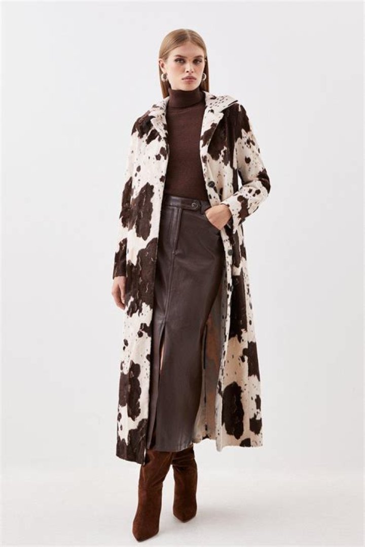 cow print coat with jeans and flats