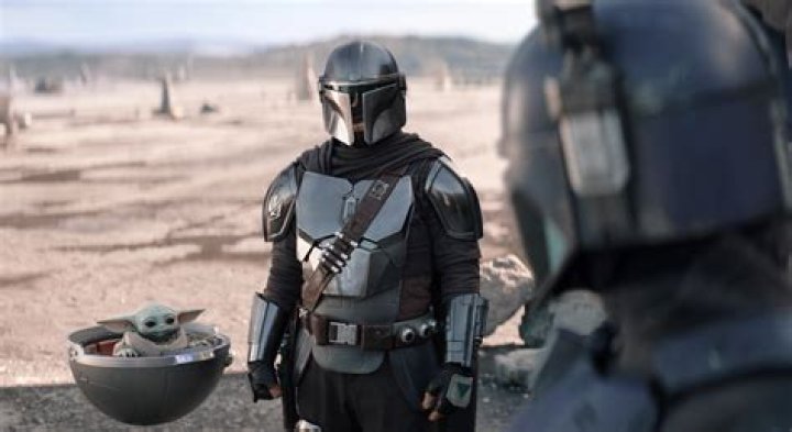 Din Djarin in The Mandalorian season 3 superimposed over Pedro Pascal as Din and Grogu