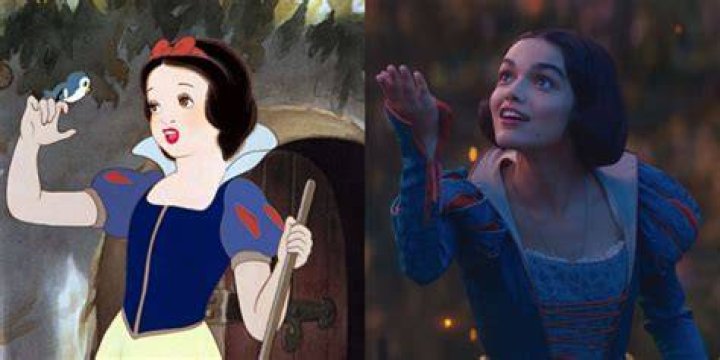 Disney Snow White being offered poison apple by evil queen disguised as old woman