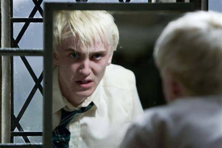 Draco looking in mirror