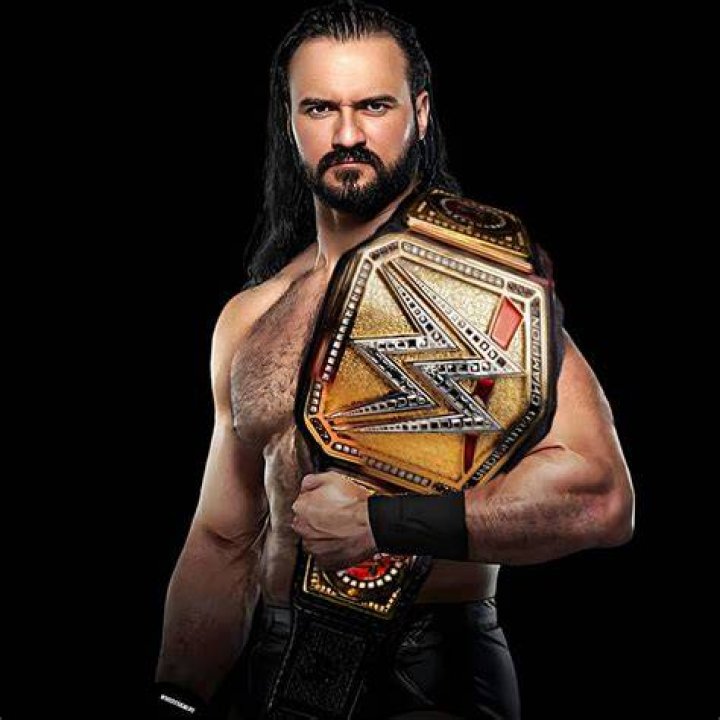 Drew McIntyre as WWE Champion and with Roman Reigns