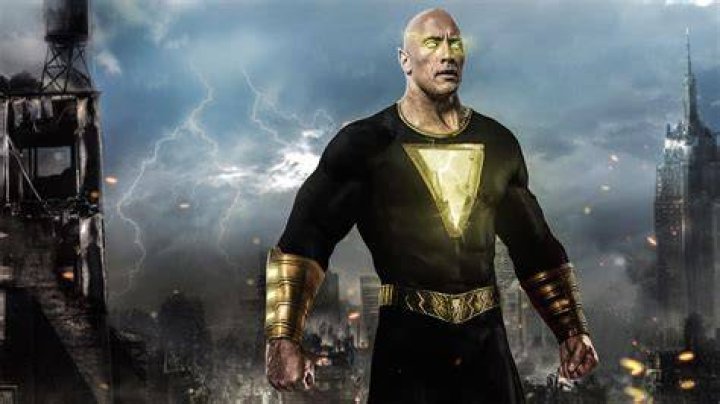 Dwayne Johnson as Black Adam sitting on his throne in Black Adam