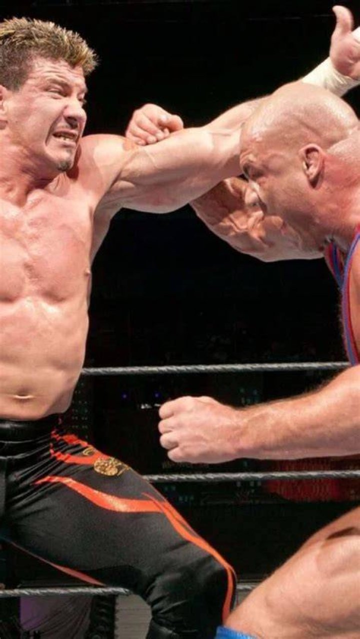 Eddie Guerrero & Kurt Angle Toss The Chair Back And Forth 