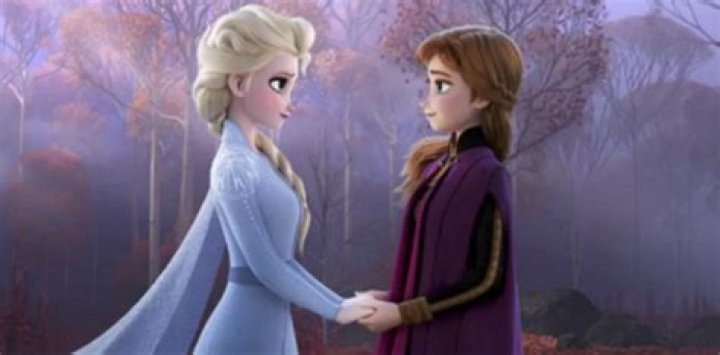 Elsa and Anna holding hands at the end of Frozen