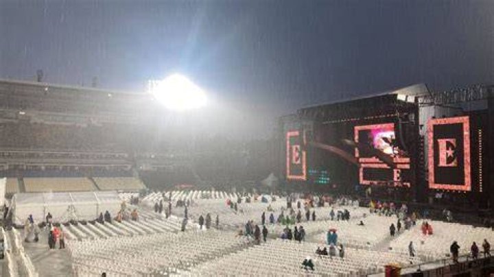 Elton John concert-goers evacuate Mt Smart Stadium after announcements the concert was cancelled following heavy rain. Photo / Nick Bewley