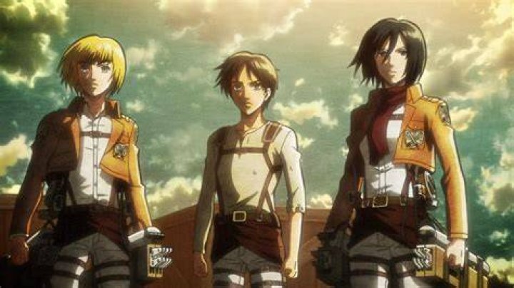 Eren, Mikasa, and Armin standing together looking surprised