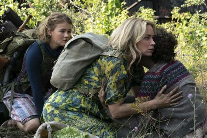 Evelyn, Regan, and Noah huddled together in A Quiet Place Part II