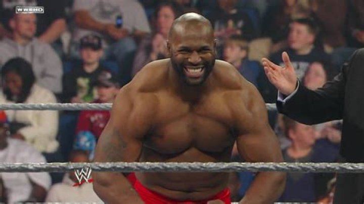 Ezekiel Jackson high-fiving fans on way to ring