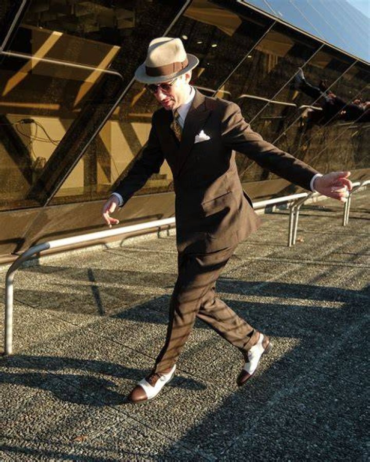 Fashion, Suit, Headgear, Hat, Event, Dress, Street fashion, Outerwear, Fedora, Fashion accessory, 