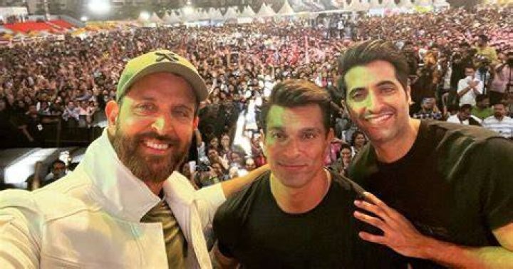 Fighter stars Hrithik Roshan, Karan Singh Grover and Akshay Oberoi pose for a selfie at an event