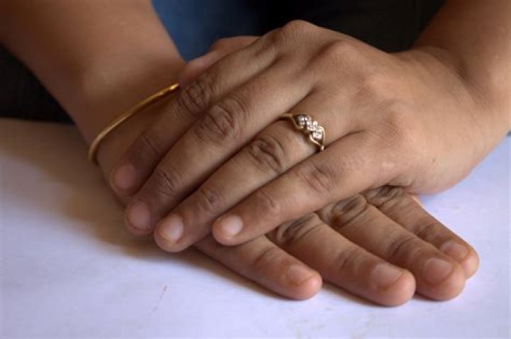 Finger, Nail, Hand, Ring, Wedding ring, Engagement ring, Thumb, Material property, Jewellery, Nail care, 