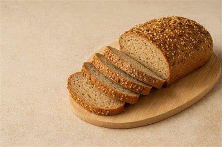 Fresh Sliced whole grain loaf of bread Fresh Sliced whole grain loaf of bread