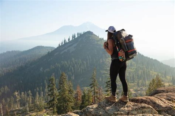 Gap year backpacker hiking rocky terrain