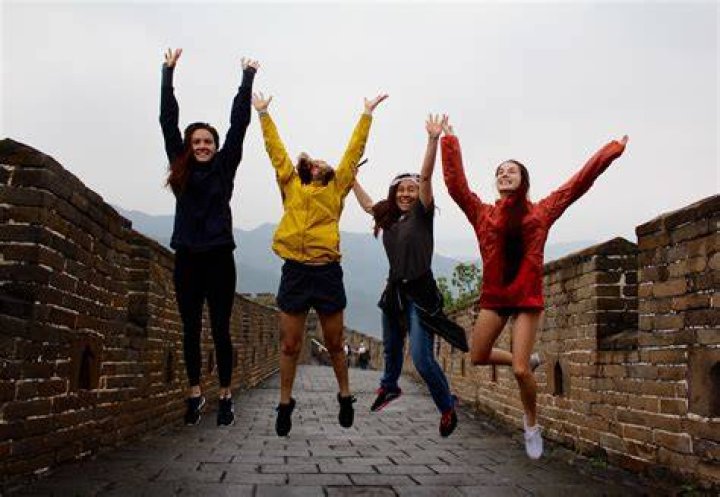 Gap year student jumping in the air