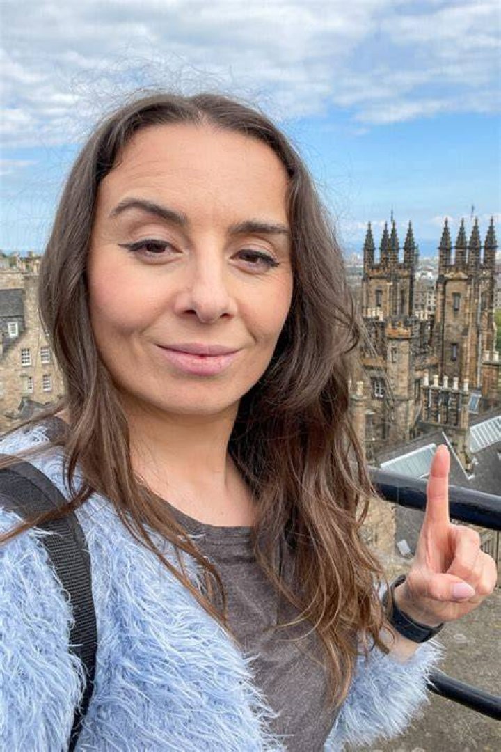 Gemma pointing at the camera in You season 4