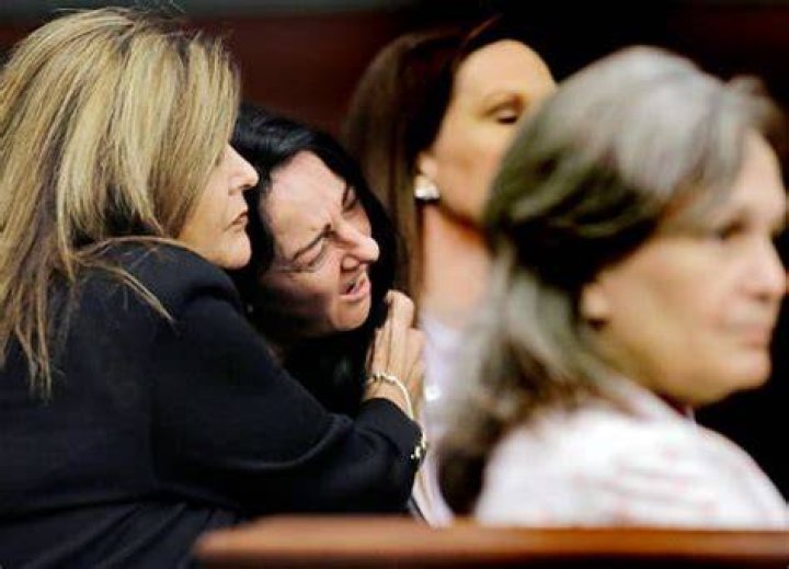 Graphic pictures and details of 8-year-old's murder elicit tears from jury and medical examiner