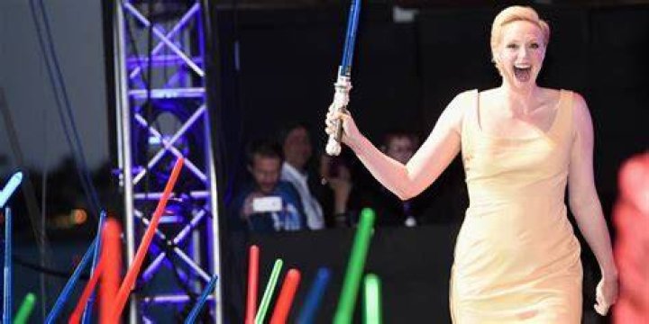 Gwendoline Christie holding lightsaber