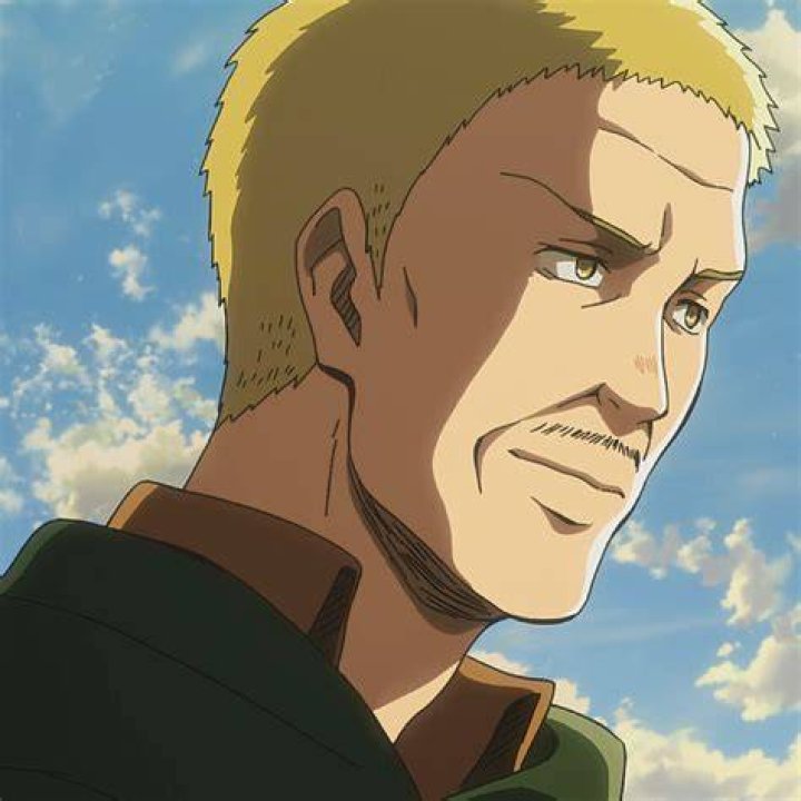 Hannes from Attack on Titan smiling under a clear blue sky