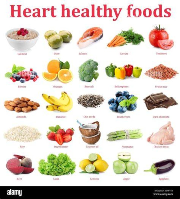 Heart healthy Mediterranean diet in heart-shape. healthy foods, which make up part of a mediterranean diet, arranged to create a heart shape, mackerel fish, ramiro peppers, bell peppers, tomatoes, nocellara and leccino olives, asparagus, carrots brussel sprouts, aubergines, red onions, avocados, green beans, spinach, corn, brocolli, potatoes, garlic, strawberries, blueberries, red grapes, bananas, orange, pecan nuts, walnuts, pumpkin seeds and mixed seeds