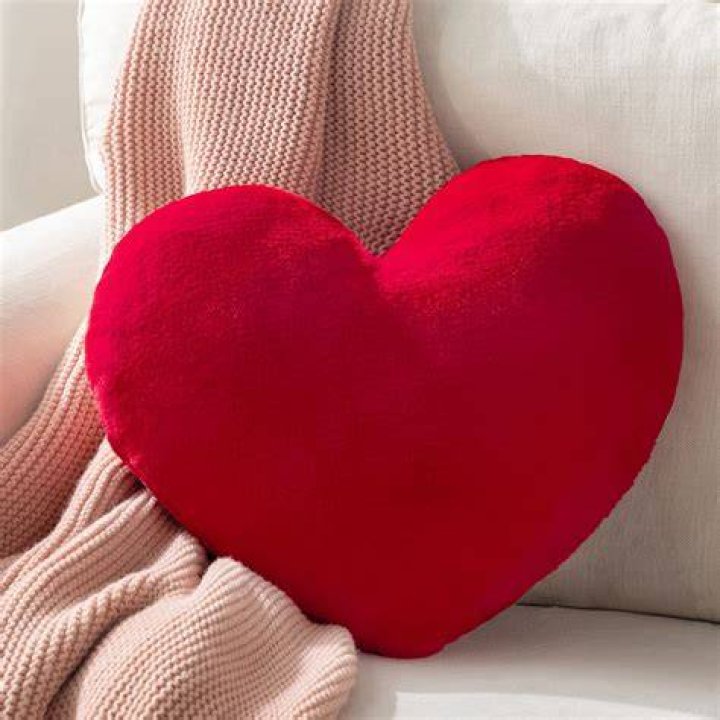 heart sex pillow in red on a white background