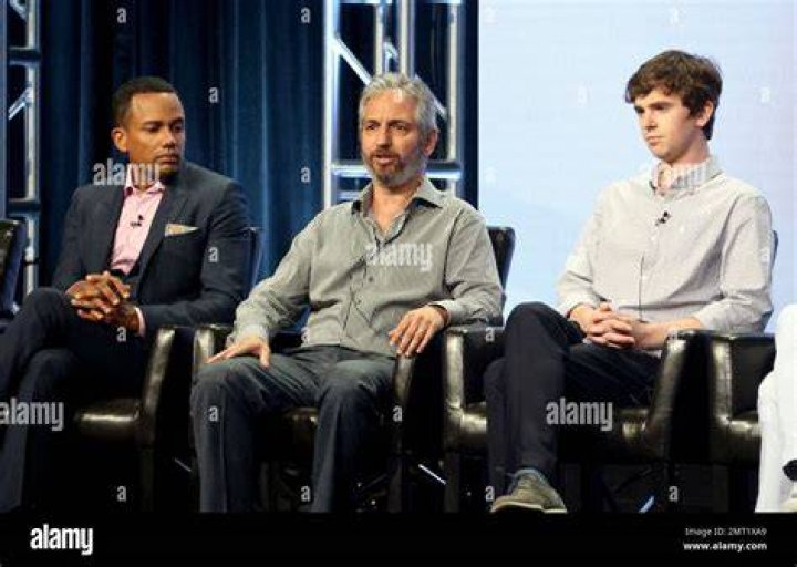 Hill Harper, Freddie Highmore, and Chuku Modu standing at a patient's bedside in The Good Doctor