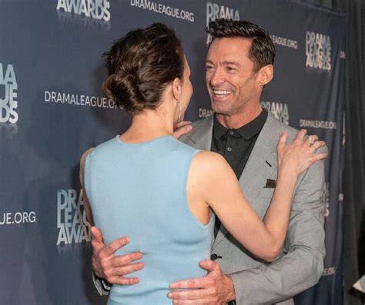 Hugh Jackman kisses costar Rebecca Ferguson as they film a passionate